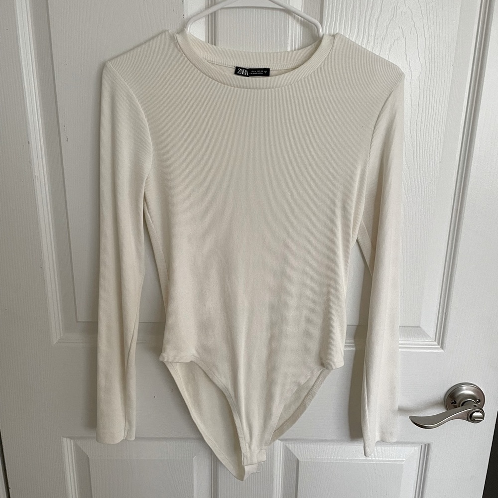 BRAND NEW ZARA bodysuit with round neck and long sleeves.